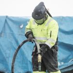 Worker in PPE Sandblasting